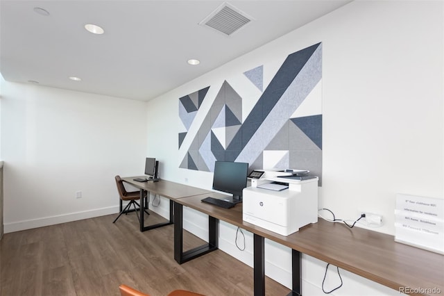 office with recessed lighting, visible vents, baseboards, and wood finished floors