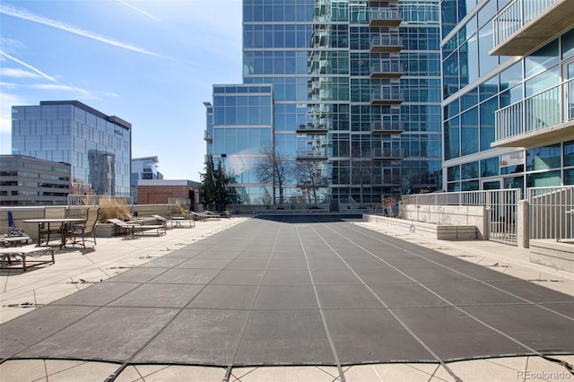 exterior space with a view of city and a patio