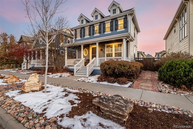 colonial inspired home featuring covered porch