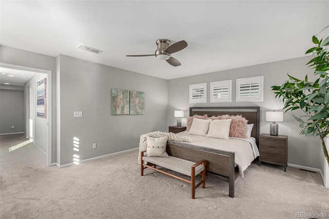 bedroom featuring light carpet and ceiling fan