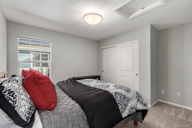 carpeted bedroom featuring a closet