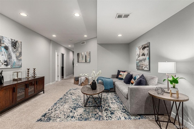 living room featuring light carpet