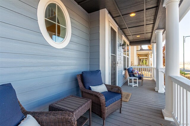 wooden terrace featuring a porch