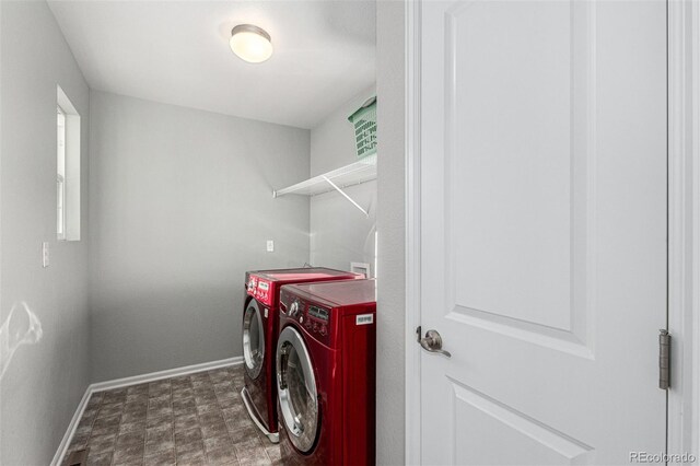 washroom featuring washing machine and clothes dryer