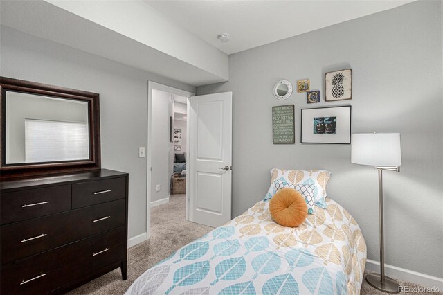 bedroom with light colored carpet