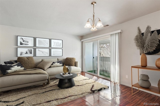 living room with an inviting chandelier and visible vents