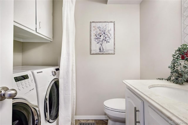 laundry room with separate washer and dryer, sink, and tile patterned flooring