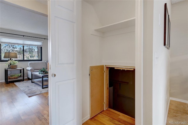 hallway with light wood-type flooring