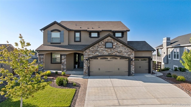 1871 Walnut Creek Ct, Colorado Springs, CO 80921 - view of front of property with stucco siding, stone siding, concrete driveway, and an attached garage