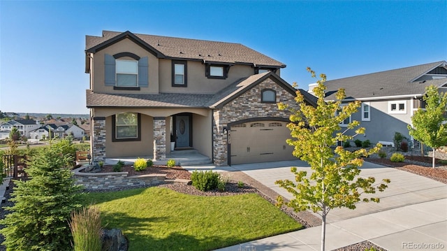 1871 Walnut Creek Ct, Colorado Springs, CO 80921 - view of front of property featuring stucco siding, driveway, stone siding, and a front lawn