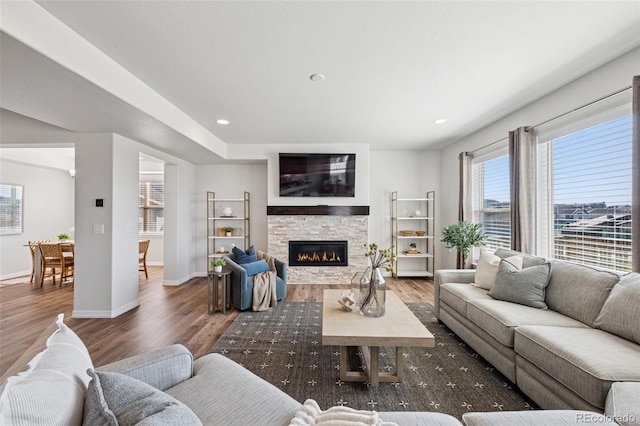 1871 Walnut Creek Ct, Colorado Springs, CO 80921 - living room featuring wood finished floors, a fireplace, and recessed lighting