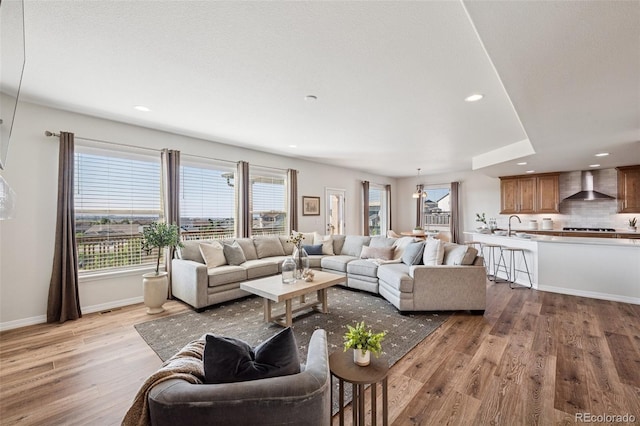 1871 Walnut Creek Ct, Colorado Springs, CO 80921 - living area with wood finished floors and recessed lighting