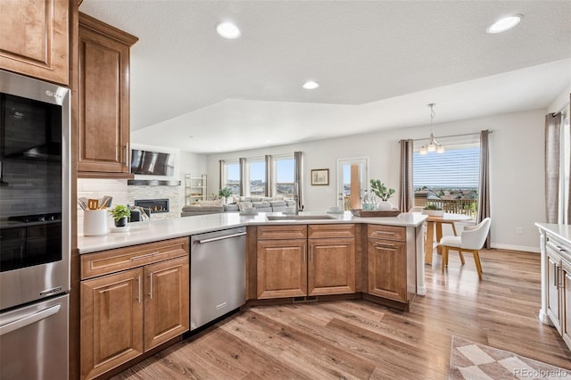 1871 Walnut Creek Ct, Colorado Springs, CO 80921 - kitchen featuring dishwasher, light wood-type flooring, plenty of natural light, light countertops, and recessed lighting