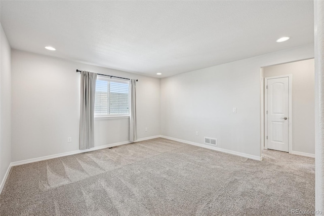 1871 Walnut Creek Ct, Colorado Springs, CO 80921 - spare room featuring light colored carpet and recessed lighting