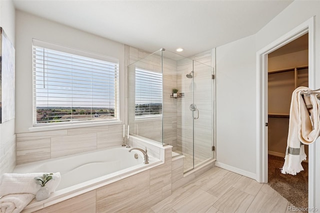 1871 Walnut Creek Ct, Colorado Springs, CO 80921 - bathroom with a garden tub, a shower stall, plenty of natural light, and a spacious closet