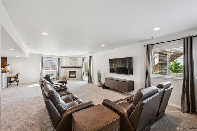1871 Walnut Creek Ct, Colorado Springs, CO 80921 - living room featuring light colored carpet, recessed lighting, and a stone fireplace