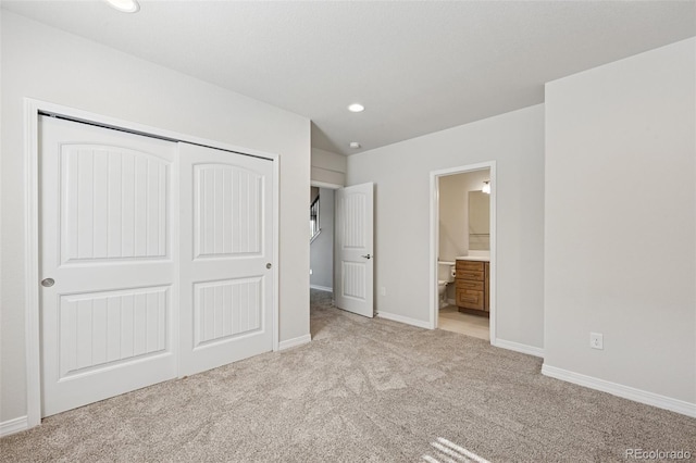 1871 Walnut Creek Ct, Colorado Springs, CO 80921 - unfurnished bedroom featuring light colored carpet, a closet, ensuite bathroom, and recessed lighting