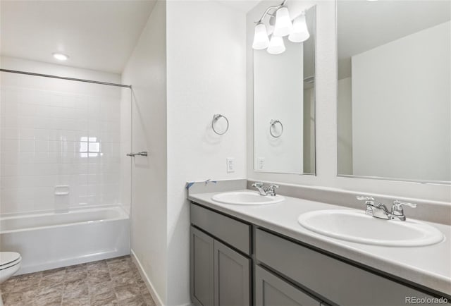 full bath featuring toilet, double vanity, baseboards, and shower / tub combination