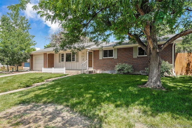 8675 W 60th Ave, Arvada, CO 80004 - single story home with an attached garage, brick siding, and driveway