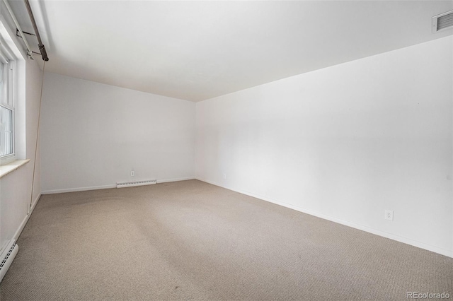 8675 W 60th Ave, Arvada, CO 80004 - unfurnished room with carpet flooring and a baseboard heating unit