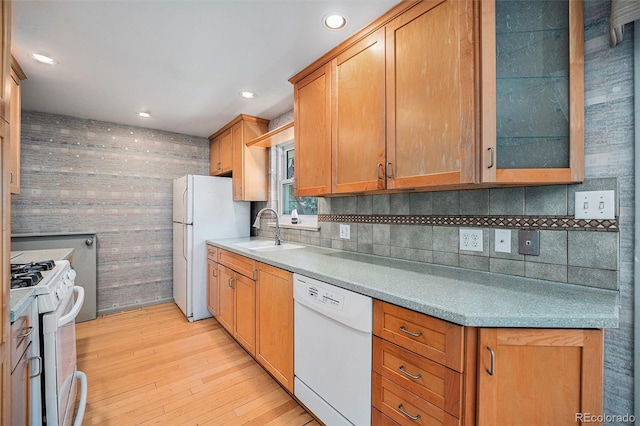 8675 W 60th Ave, Arvada, CO 80004 - kitchen with white appliances, light wood-style floors, backsplash, glass insert cabinets, and recessed lighting