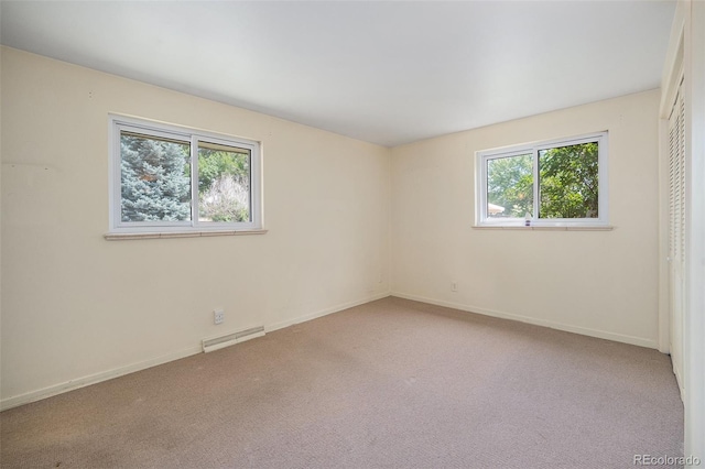 8675 W 60th Ave, Arvada, CO 80004 - carpeted empty room featuring plenty of natural light