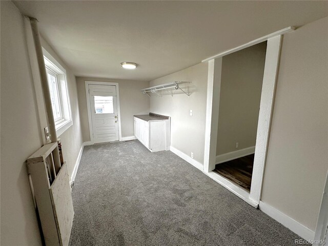 672 4th St, Limon, CO 80828 - clothes washing area with baseboards and carpet
