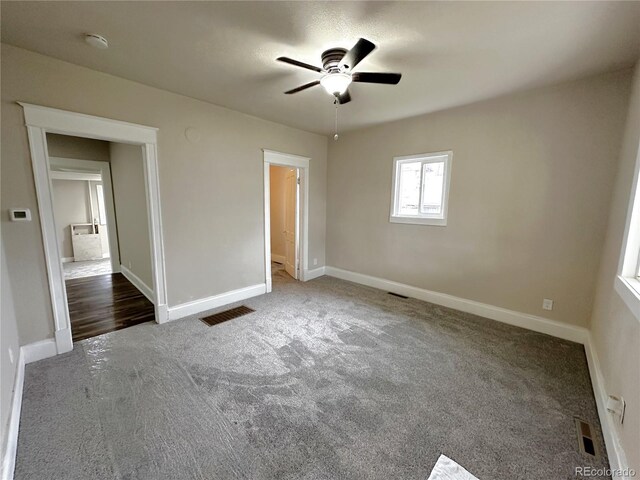 672 4th St, Limon, CO 80828 - unfurnished bedroom with carpet floors, baseboards, and visible vents