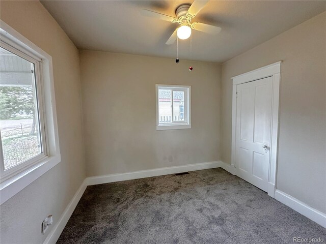 672 4th St, Limon, CO 80828 - carpeted empty room with baseboards and a ceiling fan