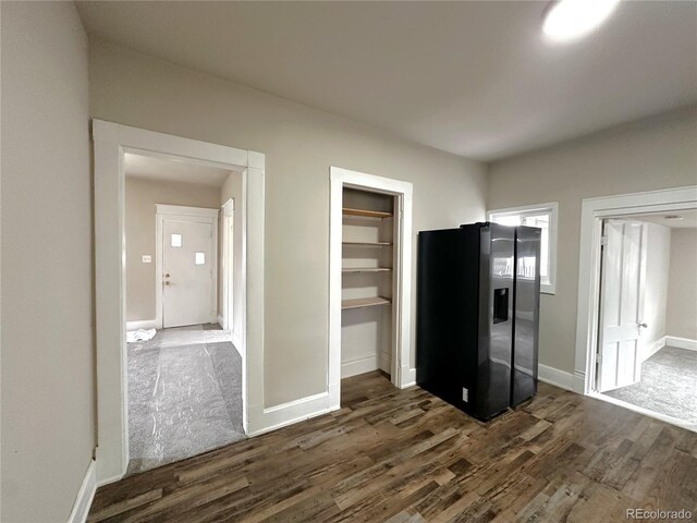 672 4th St, Limon, CO 80828 - kitchen with stainless steel fridge, baseboards, and dark wood finished floors