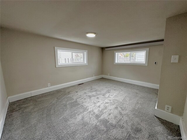 672 4th St, Limon, CO 80828 - carpeted empty room featuring baseboards, visible vents, and plenty of natural light