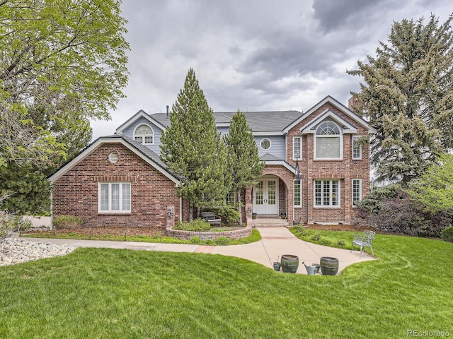 18963 E Long Ave, Centennial, CO 80016 - view of front of house with french doors, brick siding, and a front yard