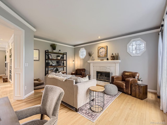 18963 E Long Ave, Centennial, CO 80016 - living area featuring a tile fireplace, light wood-type flooring, crown molding, baseboards, and recessed lighting