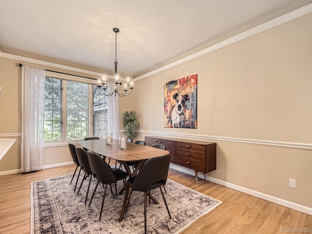 18963 E Long Ave, Centennial, CO 80016 - dining space featuring a chandelier, baseboards, ornamental molding, and light wood-style flooring