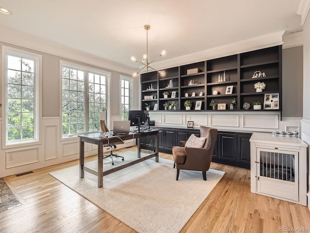 18963 E Long Ave, Centennial, CO 80016 - office space featuring crown molding, a decorative wall, a chandelier, light wood-style floors, and a wainscoted wall