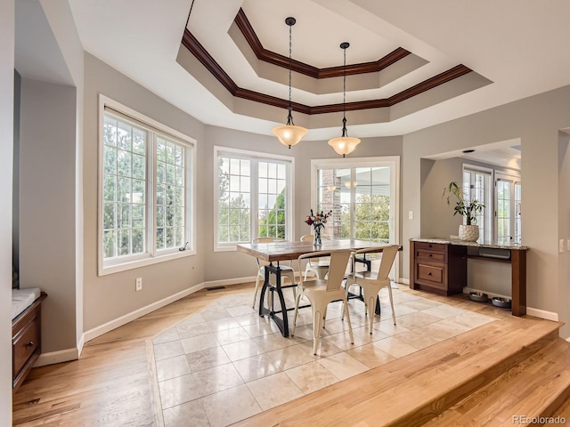 18963 E Long Ave, Centennial, CO 80016 - dining space with crown molding, baseboards, a raised ceiling, and light wood-style floors