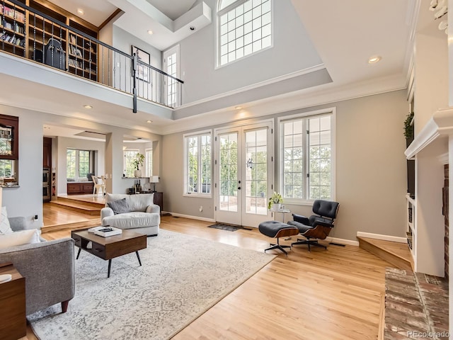 18963 E Long Ave, Centennial, CO 80016 - living area with ornamental molding, french doors, wood finished floors, baseboards, and recessed lighting
