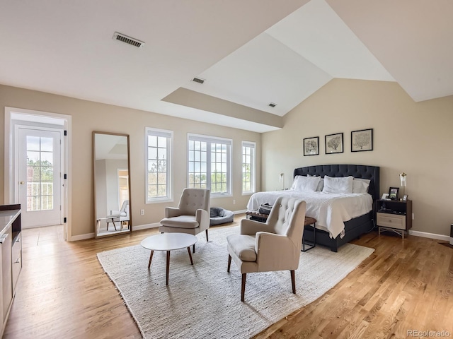 18963 E Long Ave, Centennial, CO 80016 - bedroom featuring multiple windows, light wood-style floors, baseboards, and vaulted ceiling