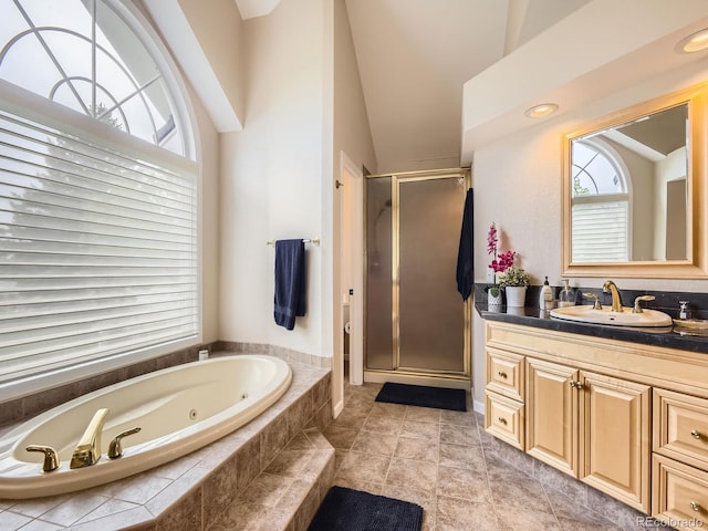18963 E Long Ave, Centennial, CO 80016 - full bathroom with vanity, lofted ceiling, a stall shower, and a whirlpool tub