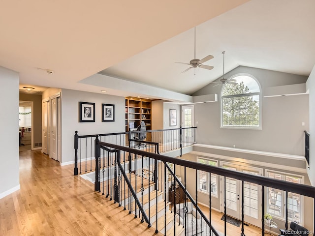 18963 E Long Ave, Centennial, CO 80016 - corridor featuring an upstairs landing, light wood finished floors, vaulted ceiling, and baseboards