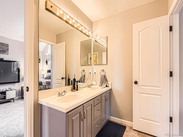 18963 E Long Ave, Centennial, CO 80016 - ensuite bathroom featuring double vanity and baseboards
