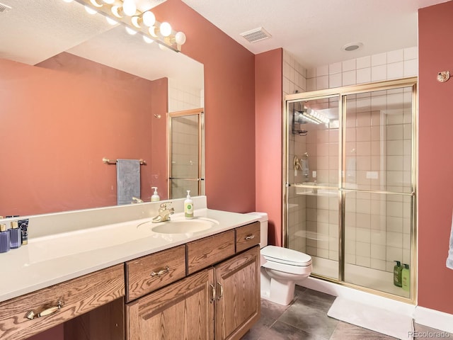 18963 E Long Ave, Centennial, CO 80016 - bathroom with toilet, a shower stall, vanity, and tile patterned floors