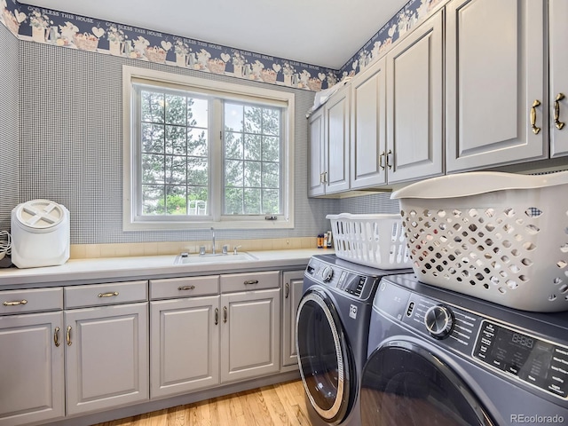 18963 E Long Ave, Centennial, CO 80016 - laundry area with cabinet space, separate washer and dryer, and light wood-style flooring