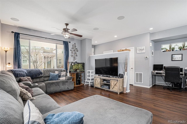 living room with ceiling fan and dark wood-type flooring