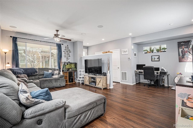 living room featuring ceiling fan and dark hardwood / wood-style floors