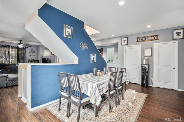 dining area featuring ceiling fan and dark wood-type flooring