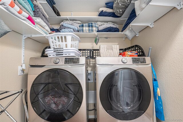 washroom with washer and clothes dryer