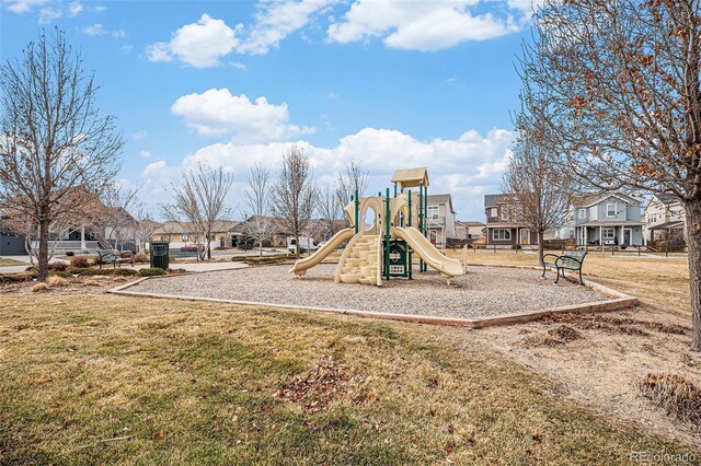 view of playground with a lawn