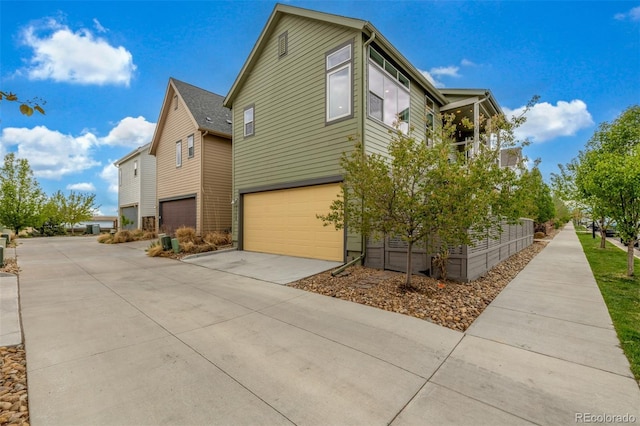 1754 W 66th Ave, Denver, CO 80221 - view of home's exterior featuring driveway and an attached garage