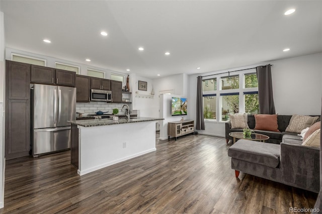 1754 W 66th Ave, Denver, CO 80221 - living area featuring dark wood-style flooring, recessed lighting, and baseboards